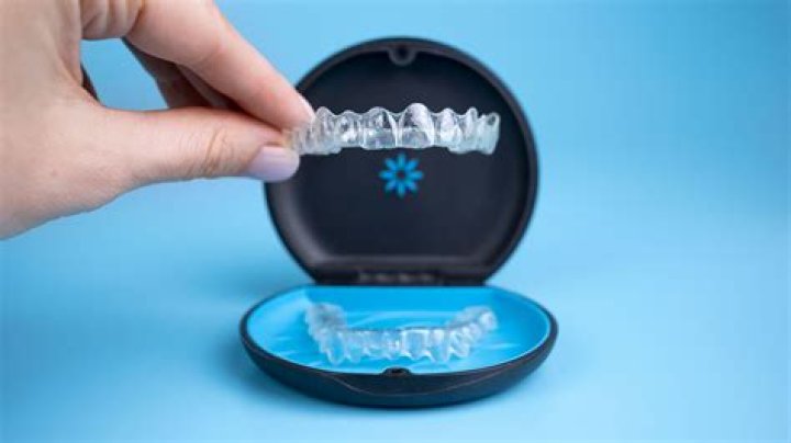 How do you get Invisalign to stop smelling?