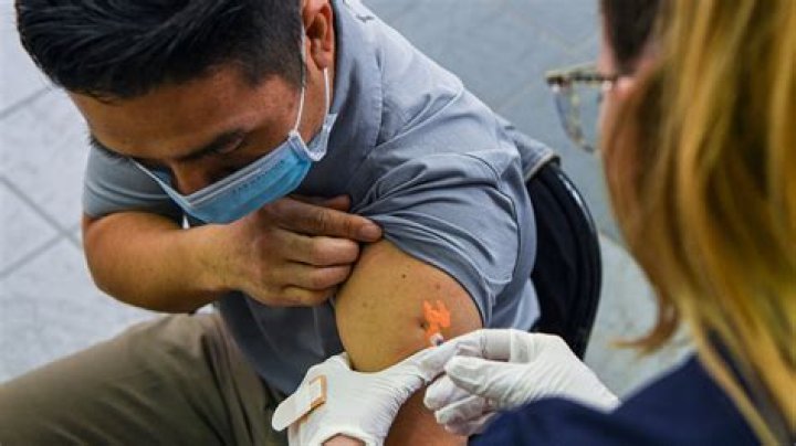 How long does arm pain usually last after getting a COVID-19 vaccination?