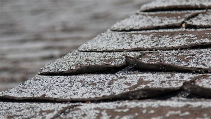 What causes roof shingles to curl?